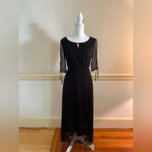 Long black dress, with sheer overlay and built-in slip; feminine and flowy.